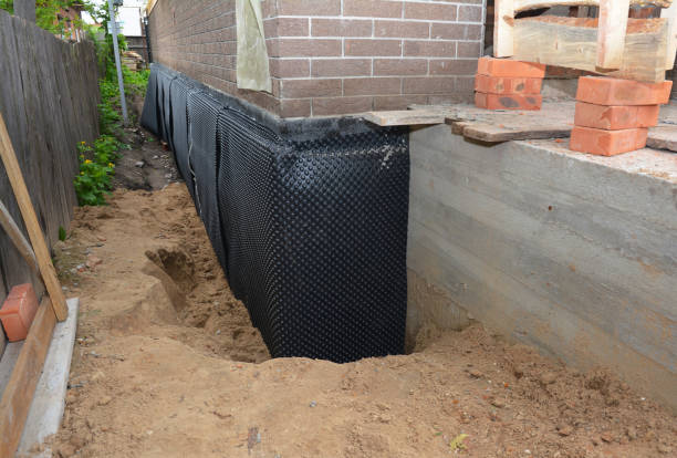 SJ Waterproofing Pros technician performing targeted Basement Waterproofing assessment in Remington, VA